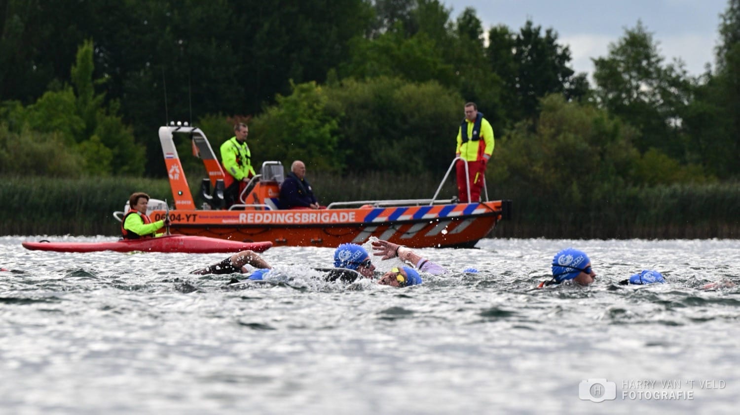 Lifeguard volunteers watching over the swim course from the water